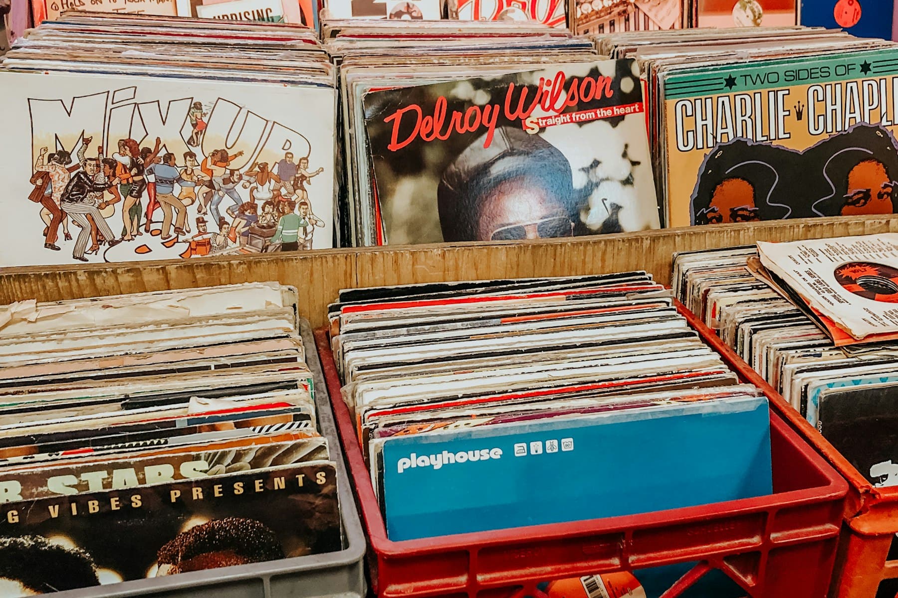 Hands flipping through a crate of records