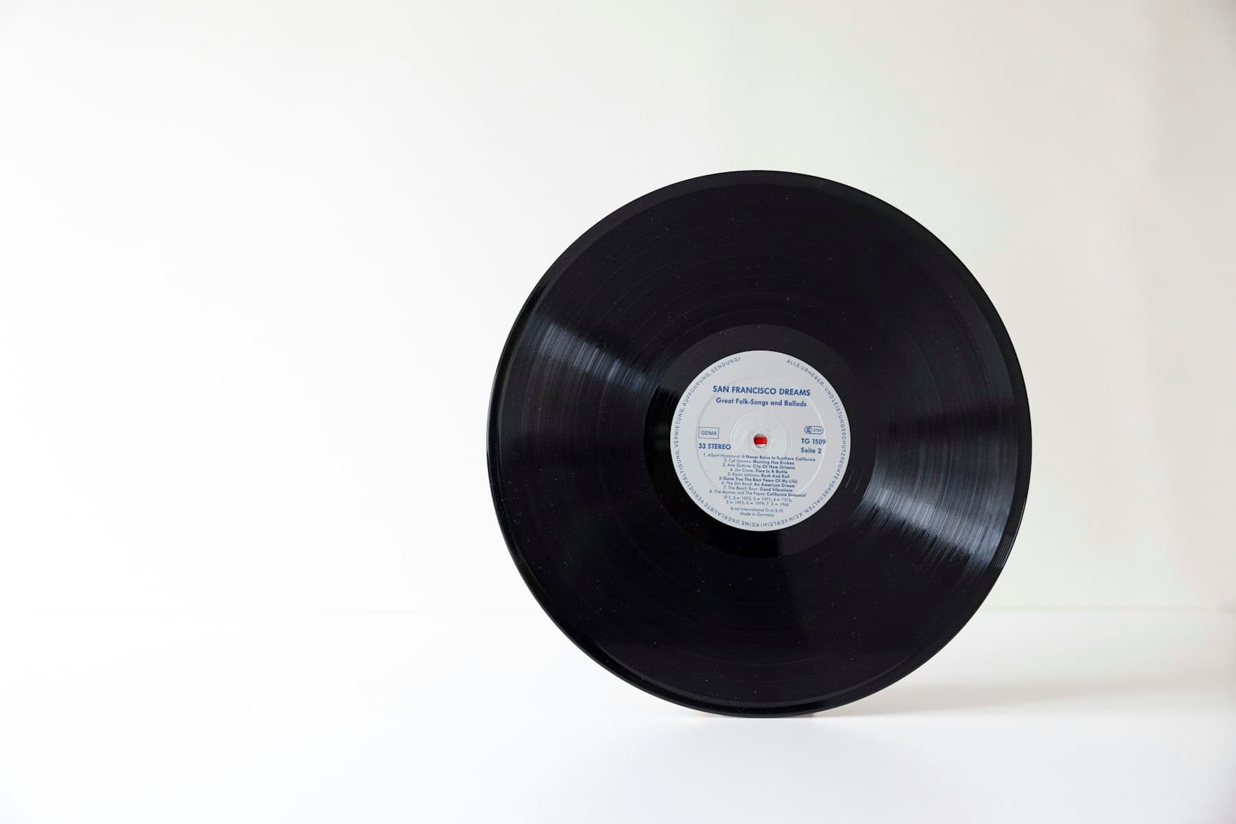 A vinyl record being cleaned